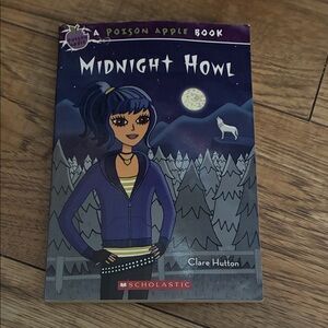 Scholastic Midnight Howl Book with Purple and Blue Cover